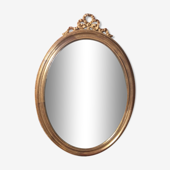 Oval mirror in gilded wood Louis XVl style