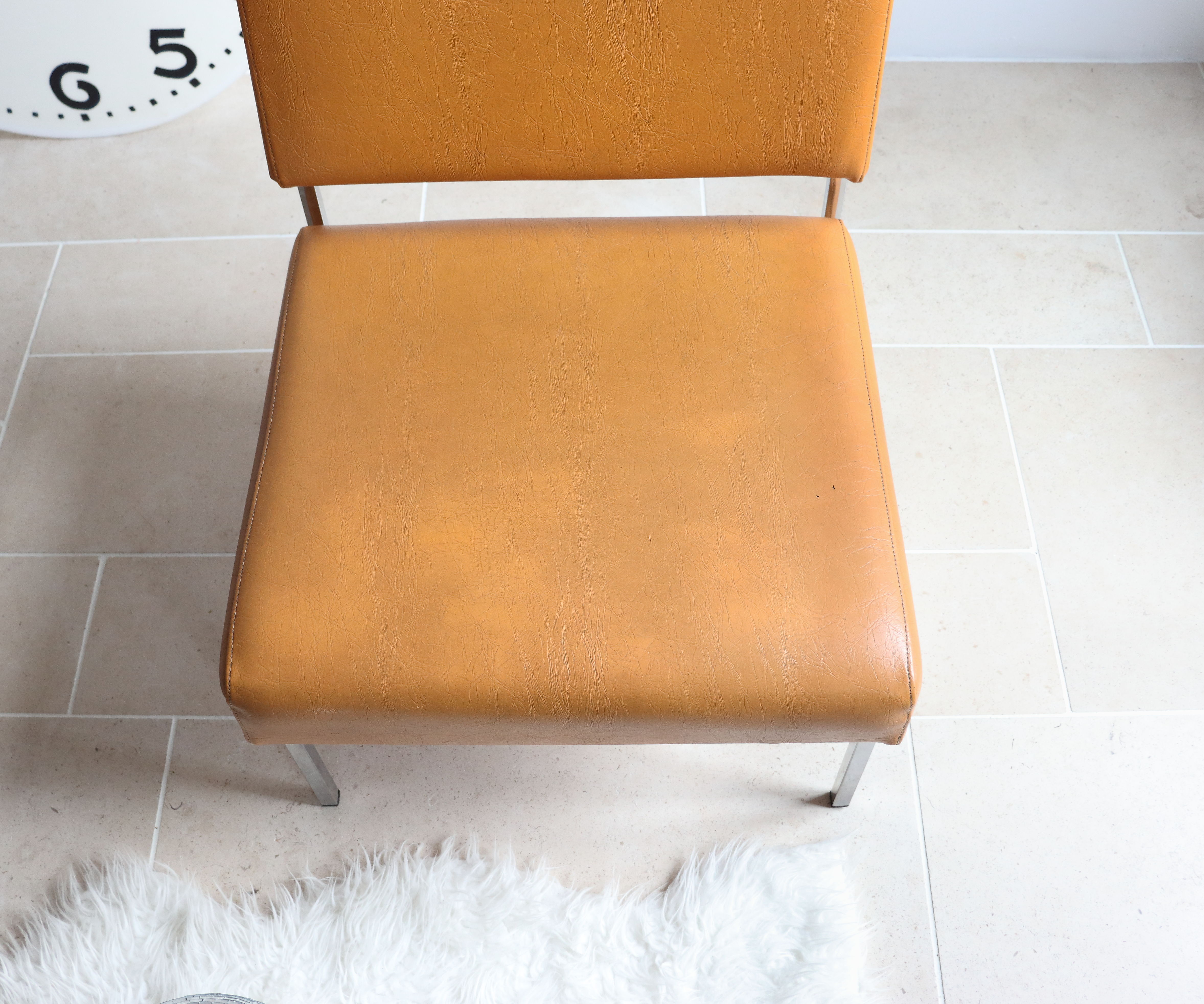 Modernist armchair in chromed metal and imitation leather, 50s/60s