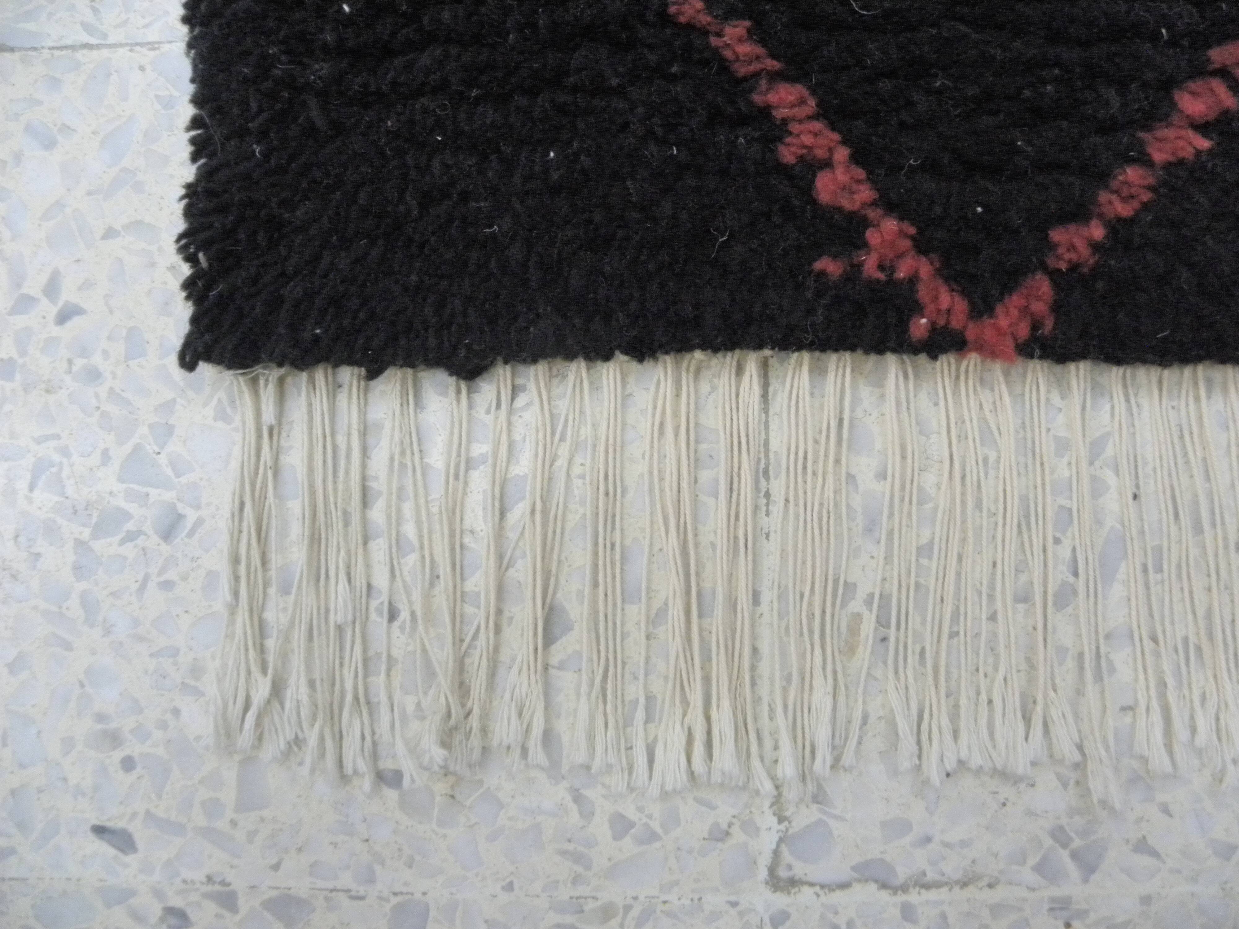 Vintage ancestral black Berber rug in wool