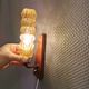 A set of Danish wall lights in champagne coloured glass with brass and teak.