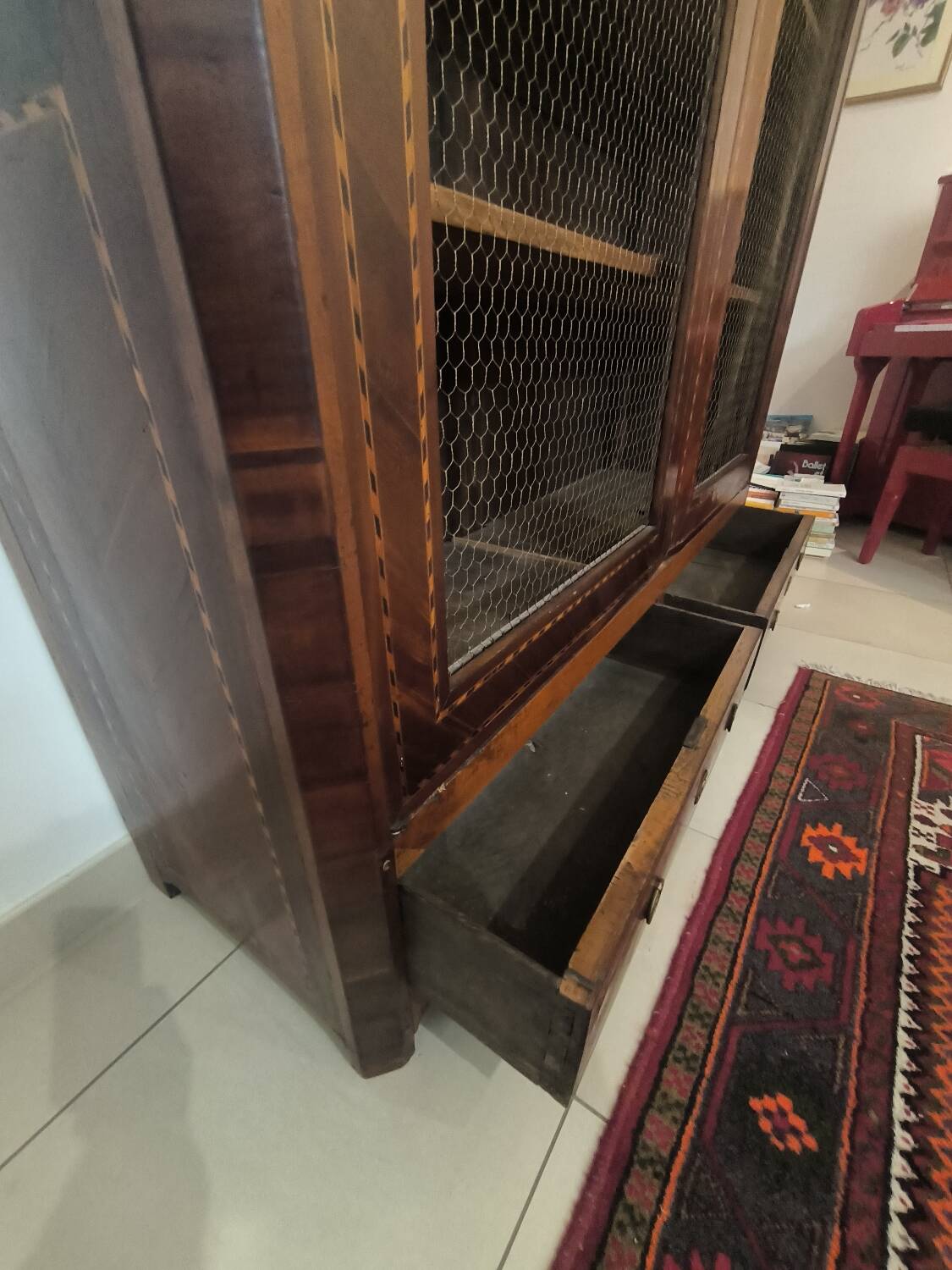 Library in marquetry with a grille from the Louis XVI period.