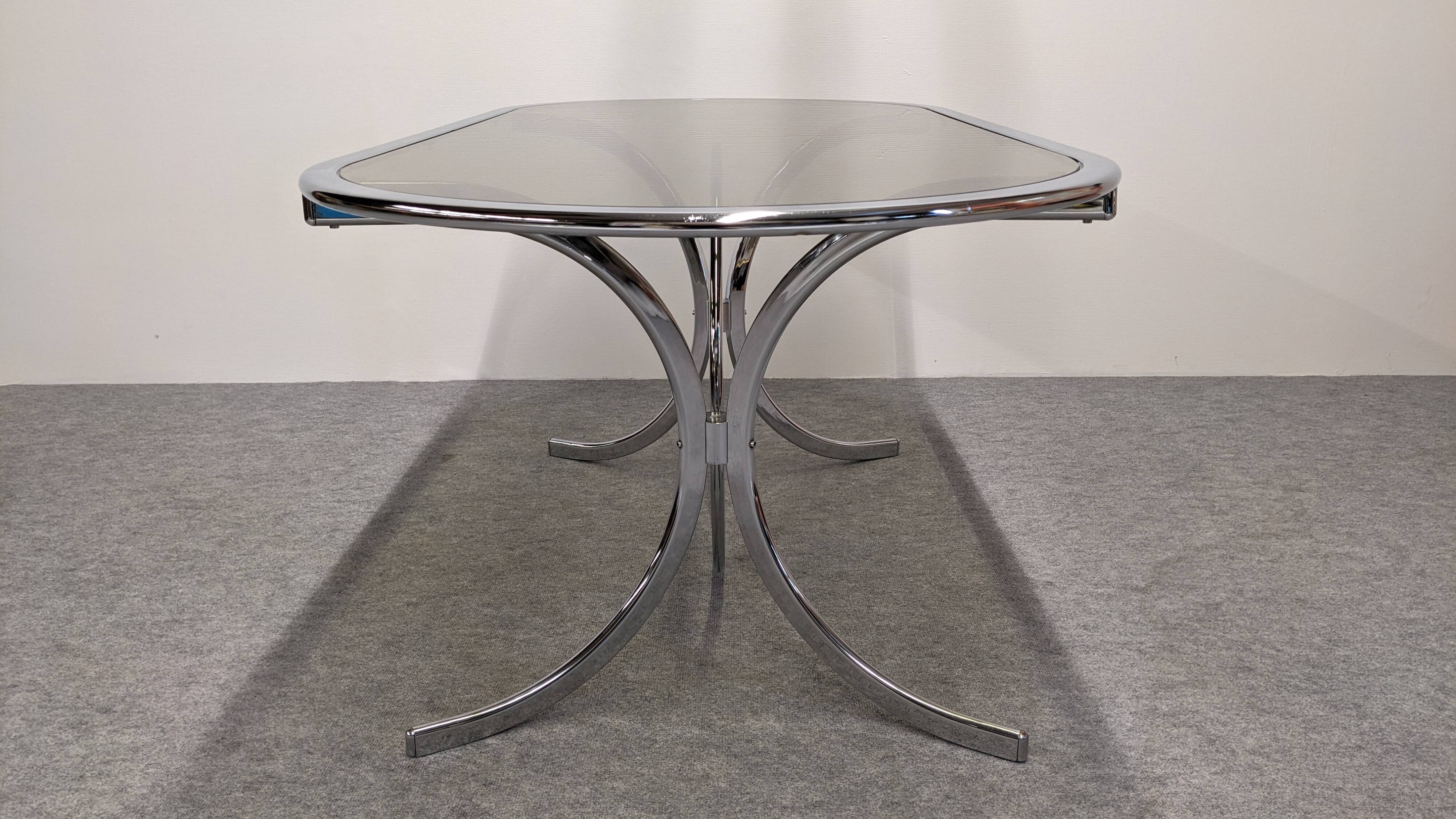 Chrome metal and smoked glass dining table, Italy circa 1970.