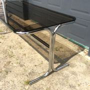 Dining table of the 70s in smoked glass and chromed metal