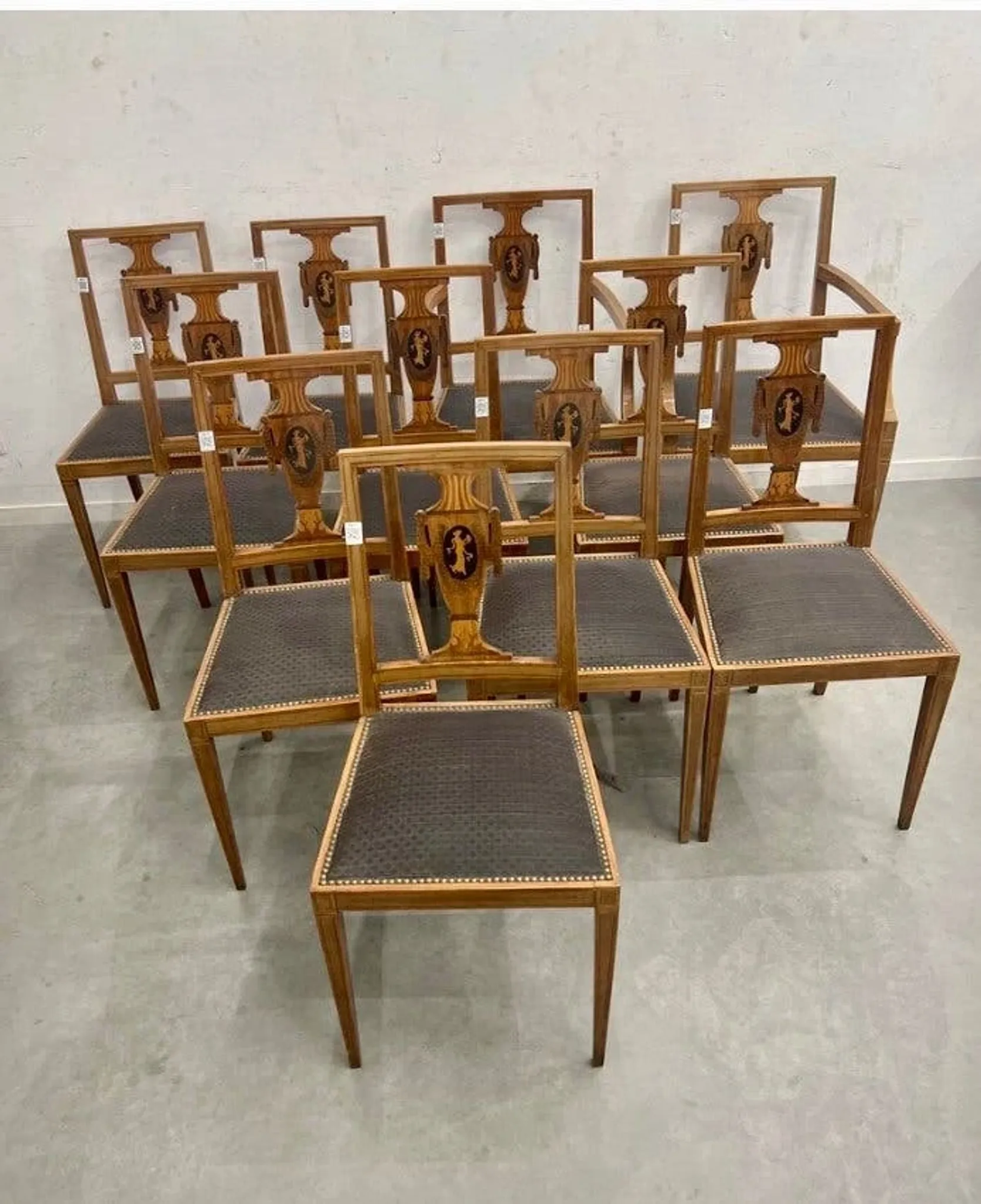Set of 9 neoclassical chairs and 2 armchairs in marquetry.