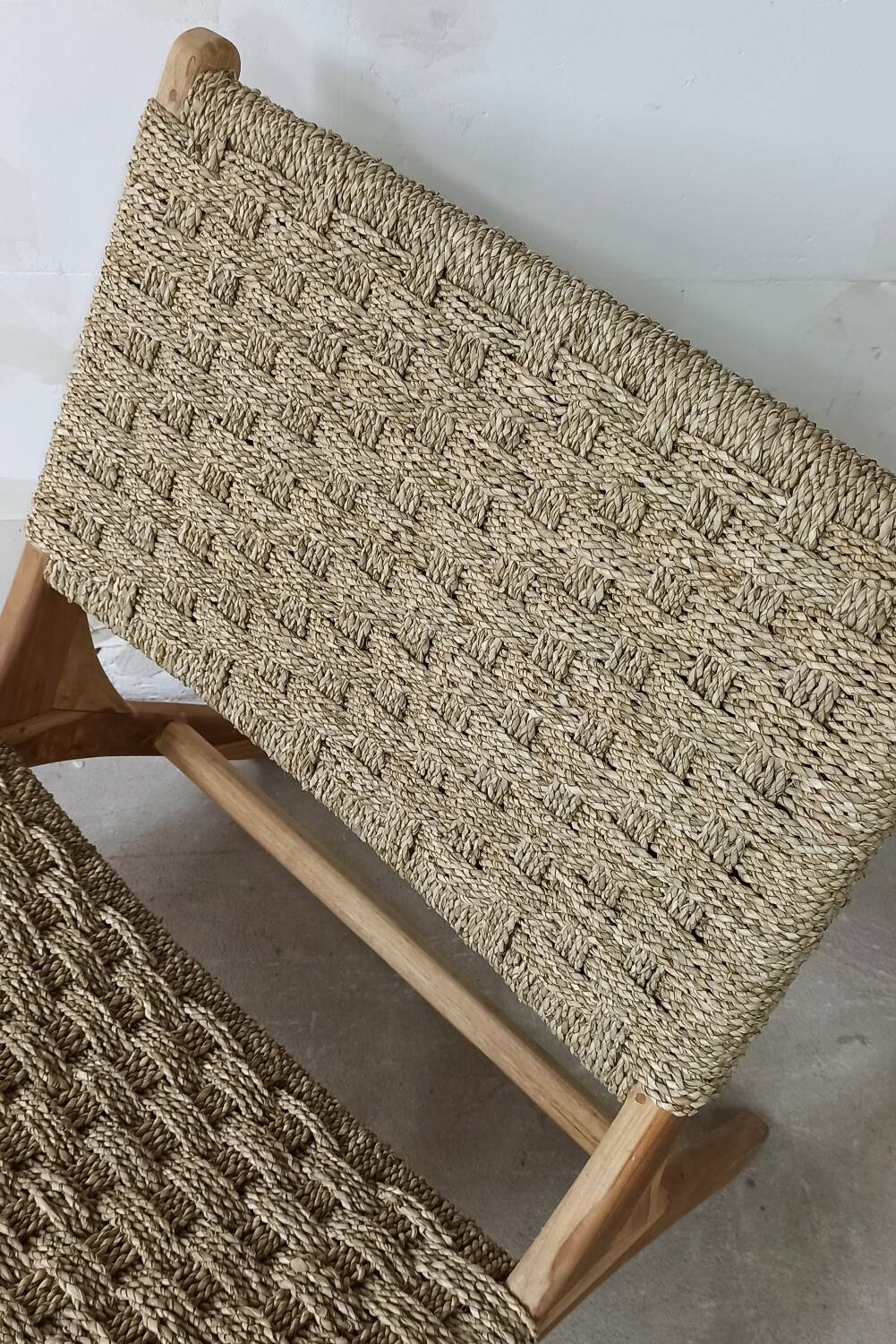 Pair of low armchairs in wood and woven rattan