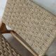 Pair of low armchairs in wood and woven rattan