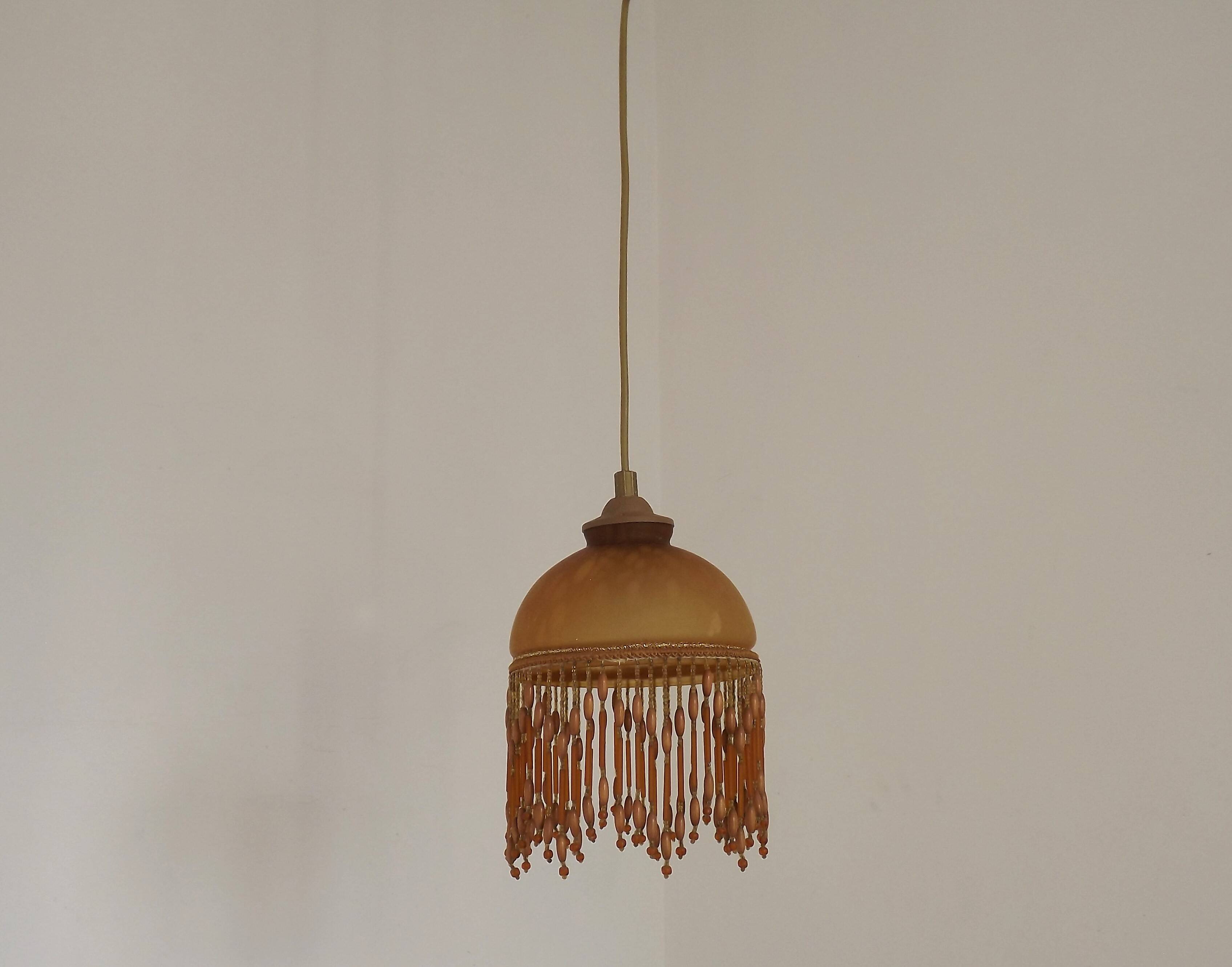 Vintage French amber mottled glass hanging ceiling light with beaded fringe.