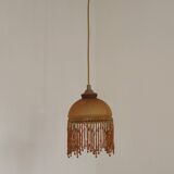 Vintage French amber mottled glass hanging ceiling light with beaded fringe.