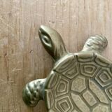 Vintage brass turtle pocket emptier