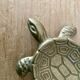Vintage brass turtle pocket emptier