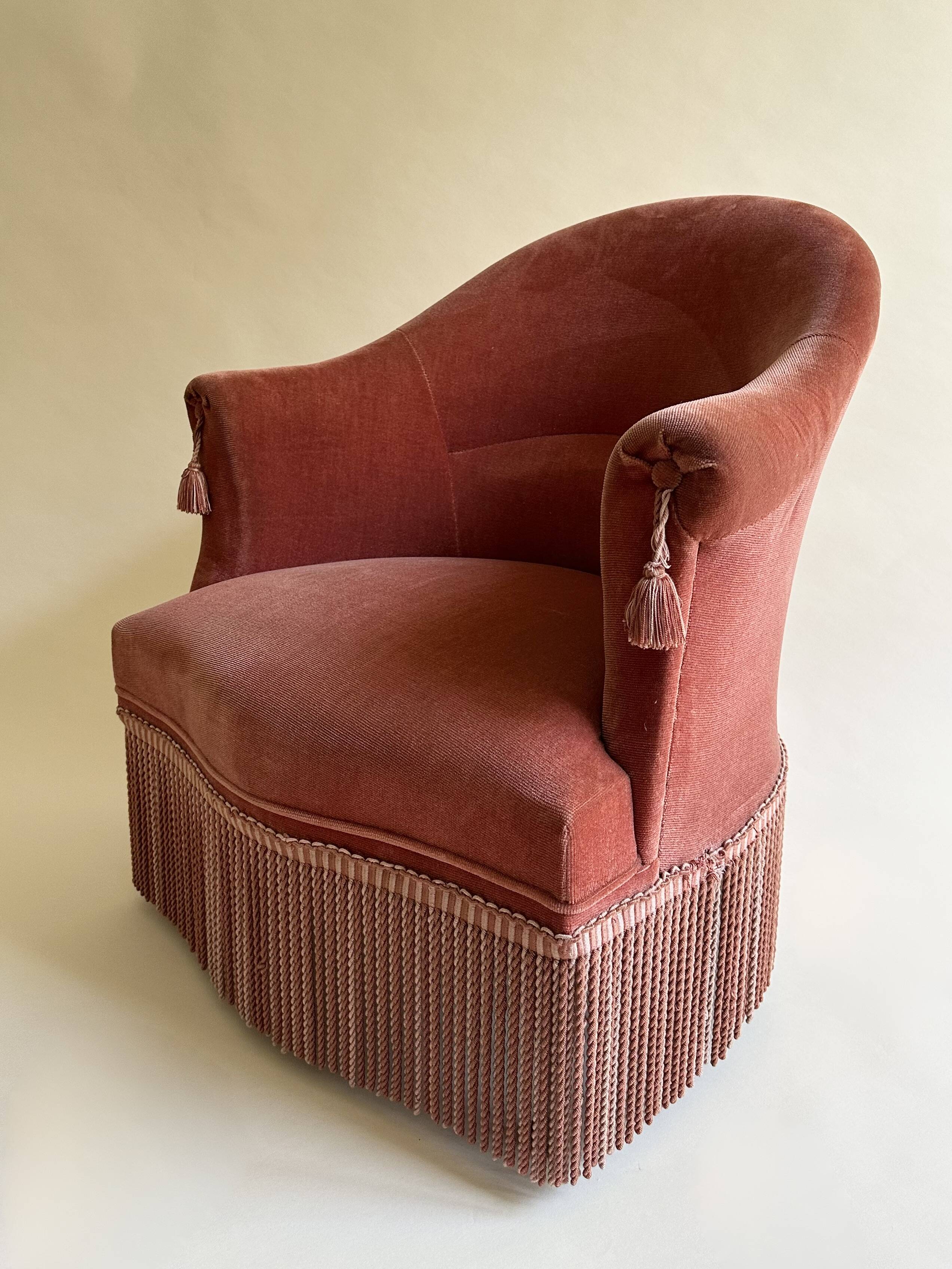 Pink-orange velvet tub chair