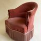 Pink-orange velvet tub chair