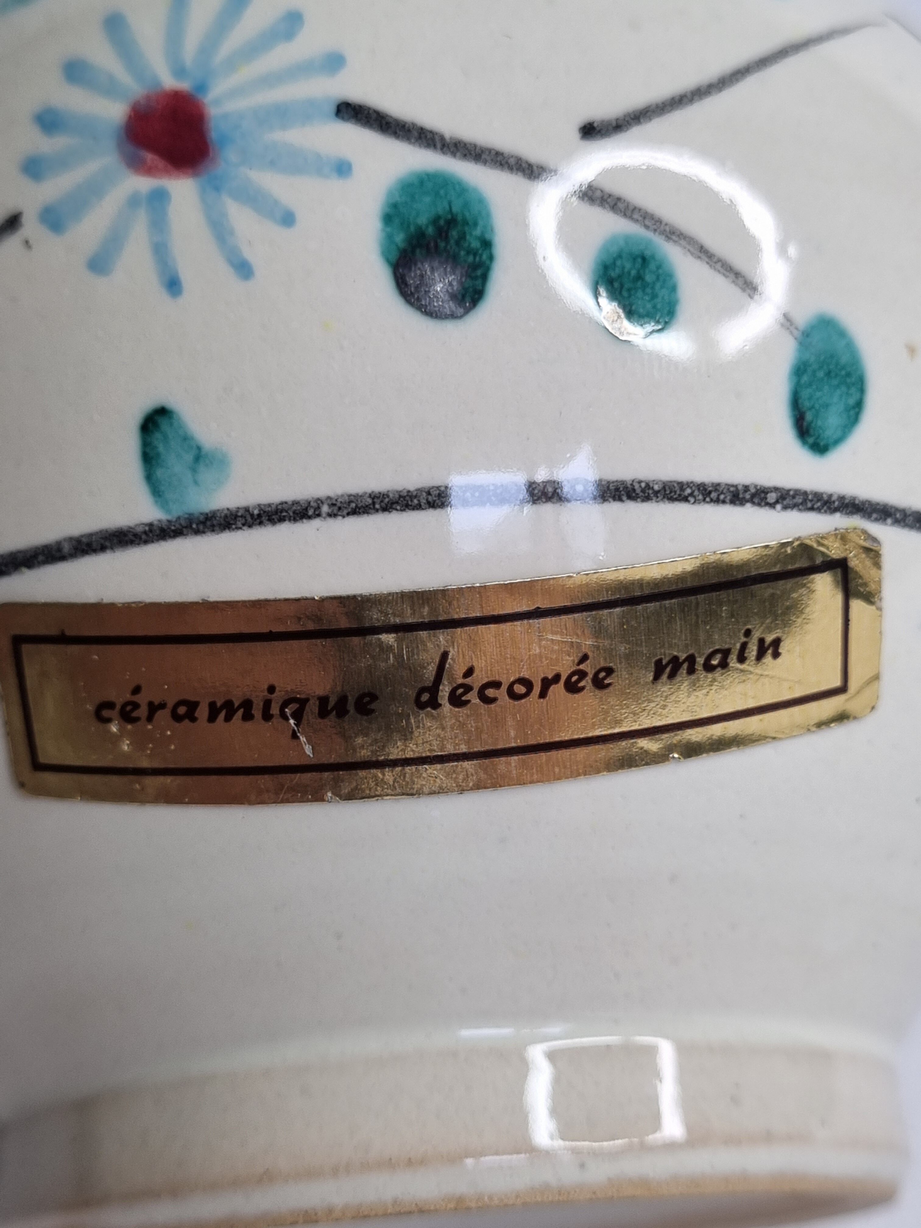 Pair of hand decorated enamelled ceramic vases, 13 cm