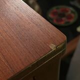 Extendable teak and teak veneer dining table