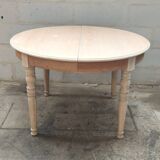 Round table with two raw cherry wood extensions