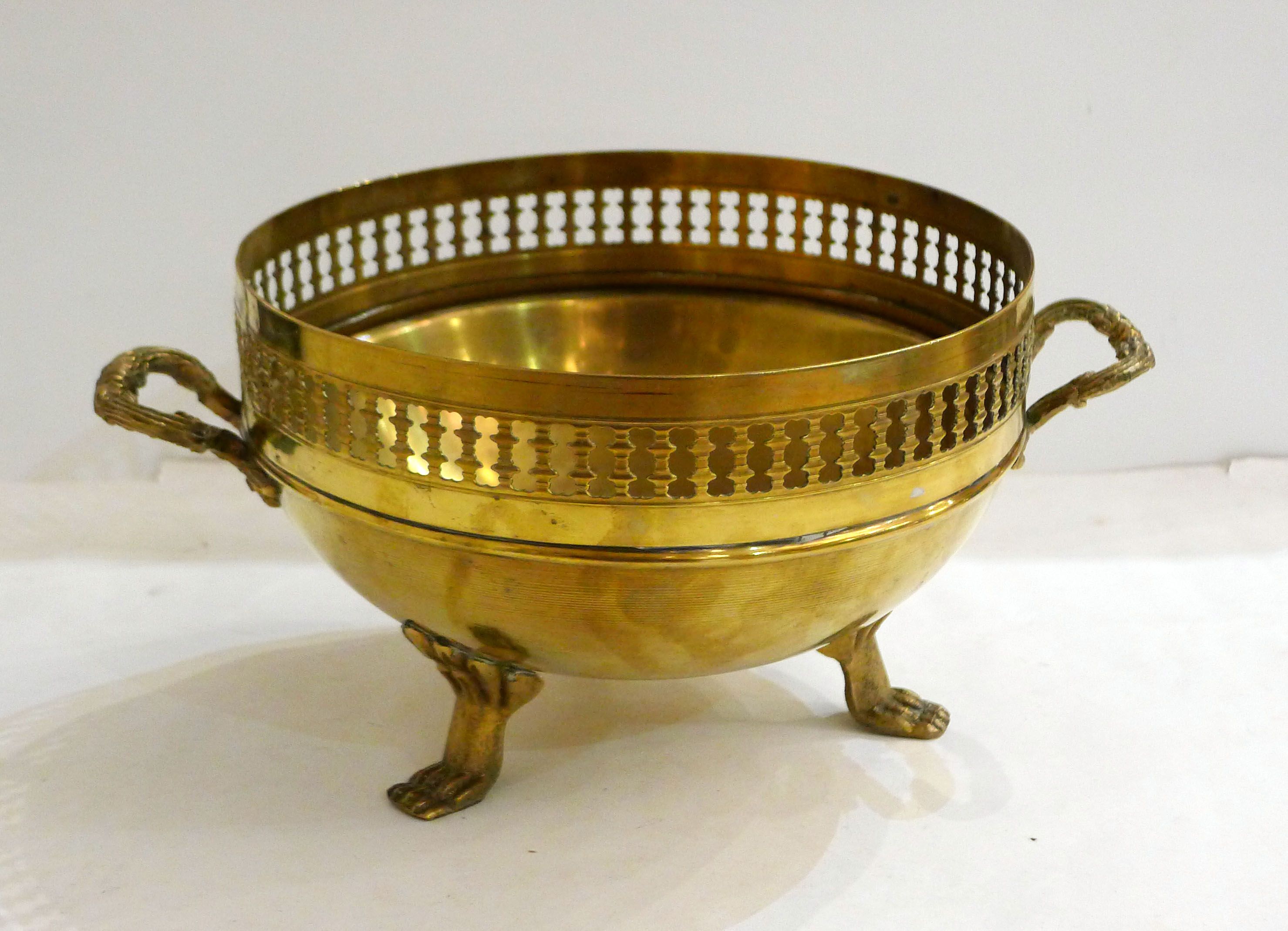 Planter on lion legs, made of golden metal
