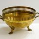 Planter on lion legs, made of golden metal