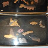 Set of two brown and black Chinese lacquer trays with bird decor