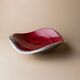 Red enameled steel bowl with textured interior and silver exterior; vintage Italian 1970s design