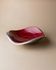 Red enameled steel bowl with textured interior and silver exterior; vintage Italian 1970s design
