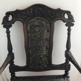 Old carved wooden armchair