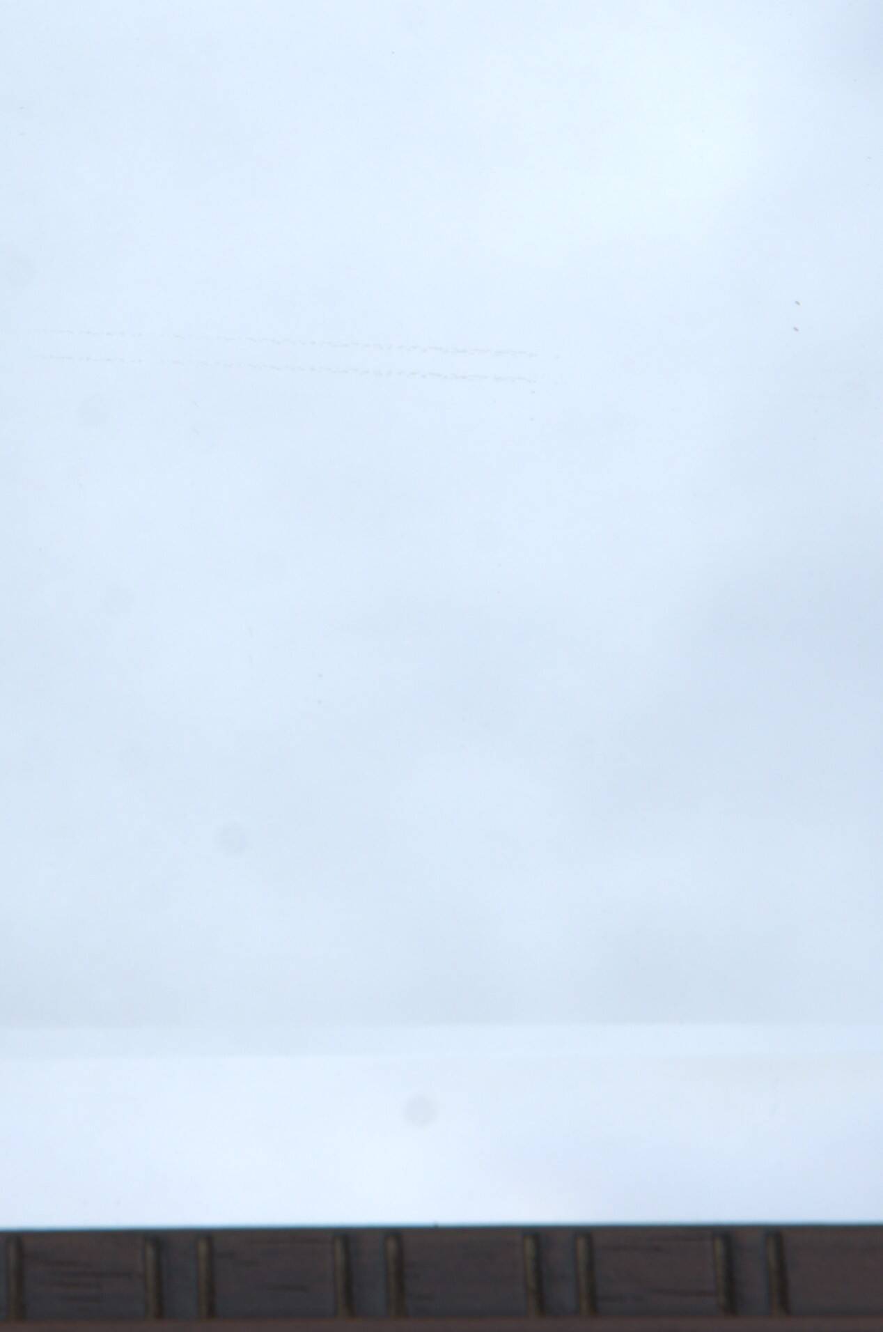 Vertical mirror, bevelled glass and carved wooden frame, 68x88cm