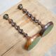 Paire de bougeoirs anciens en bois et bronze
