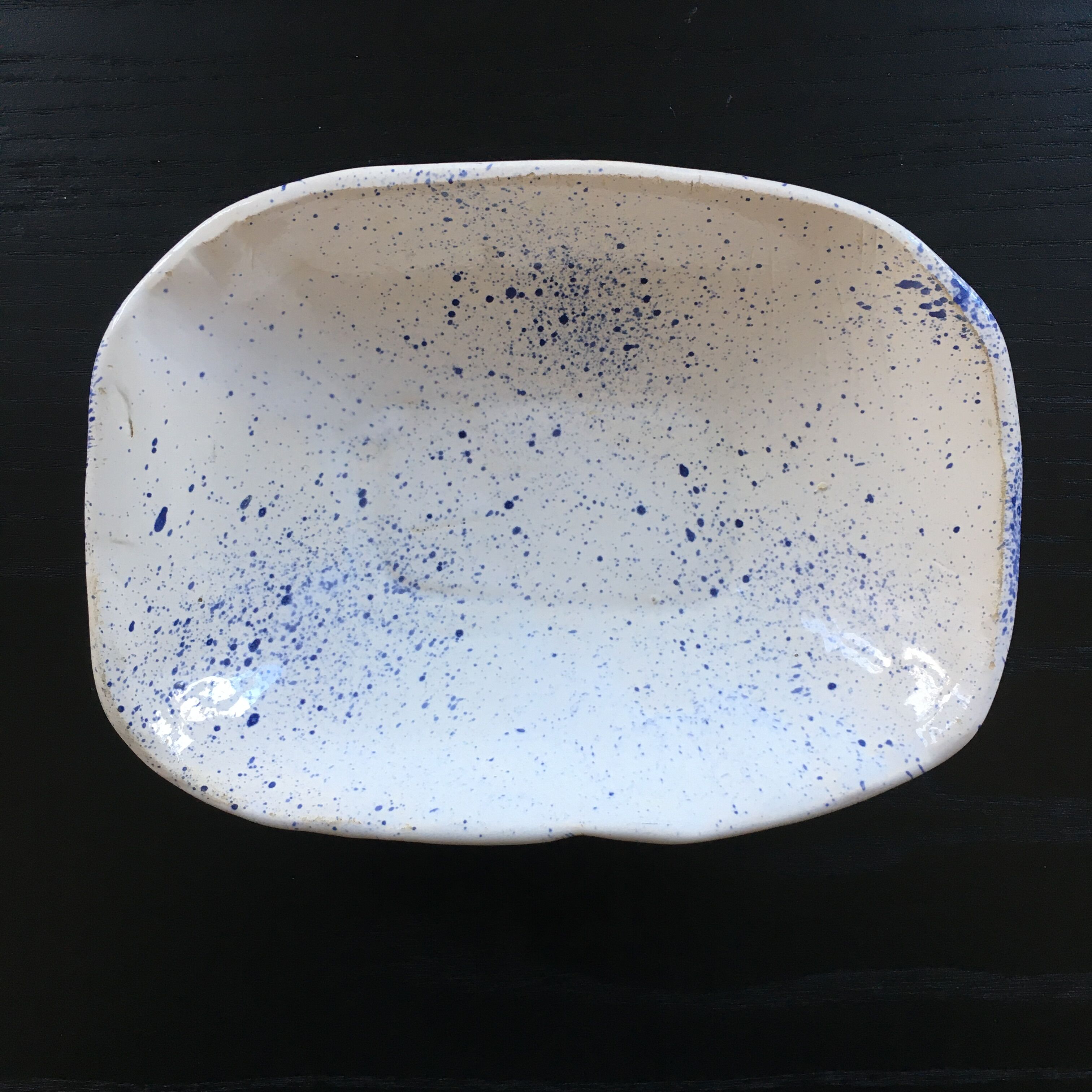 Empty blue speckled white pocket