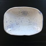 Empty blue speckled white pocket