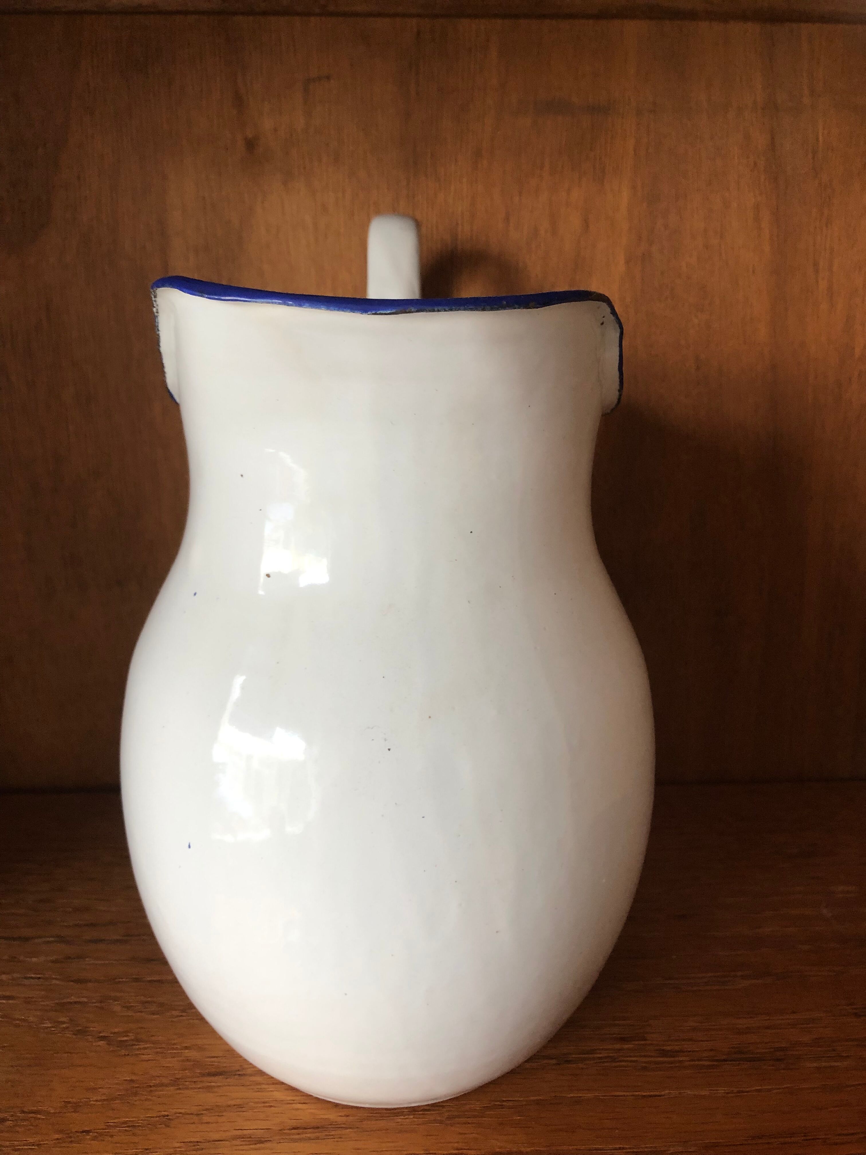 Enamelled plate pitcher