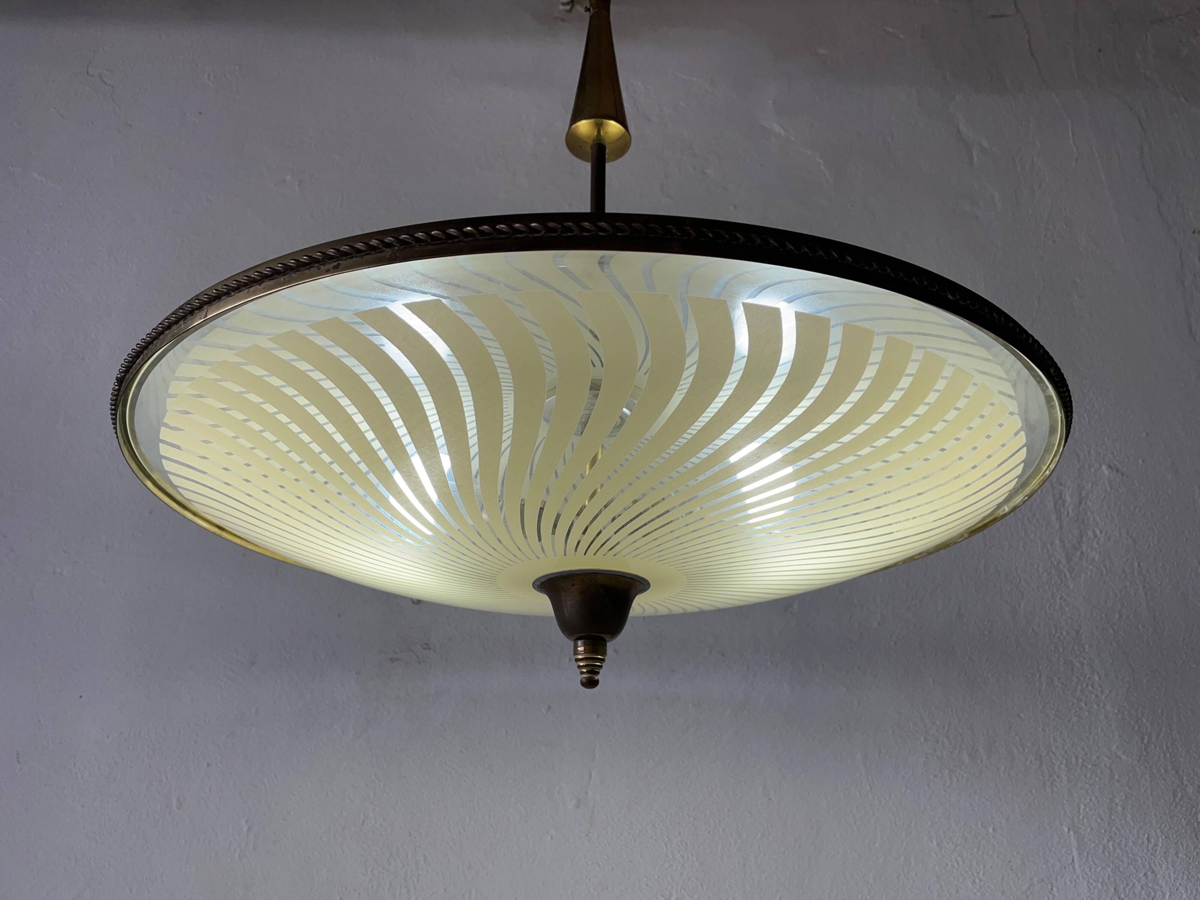 Large UFO design ceiling light in brass and printed glass, 1950s, Italy.