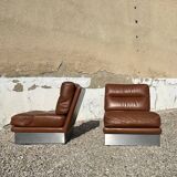 2 armchairs and 1 ottoman in brushed aluminium and brown leather, France, 1970.