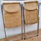 Pair of vintage metal and cane folding chairs