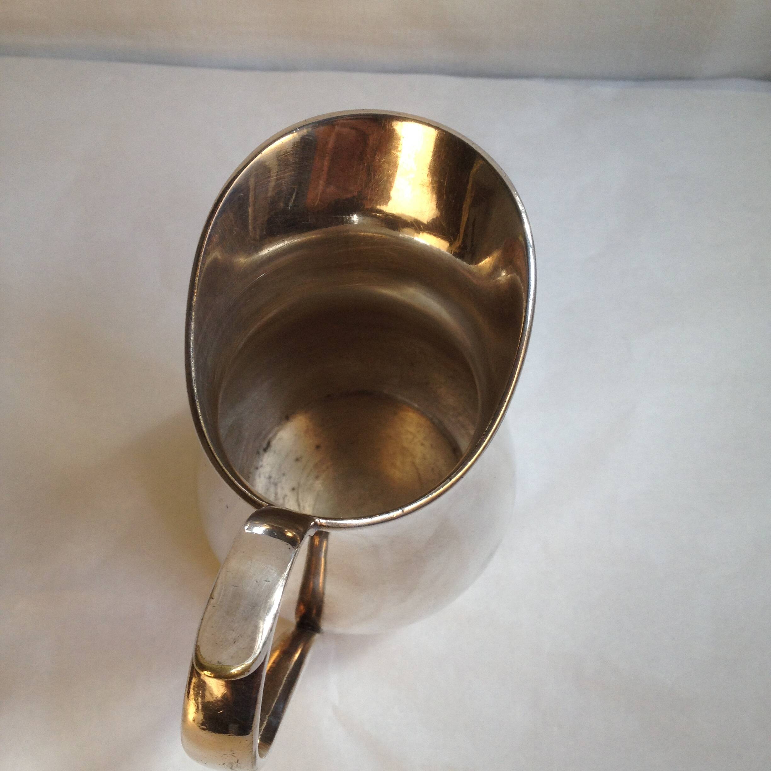 Silver metal milk jug