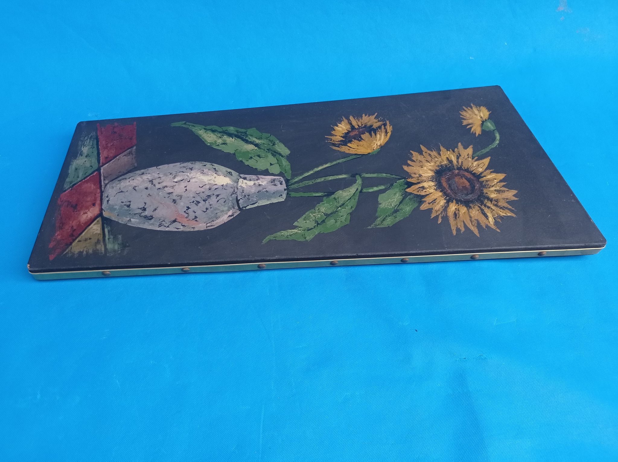 Painting of sunflowers in a vase comes from the 60's / 70's