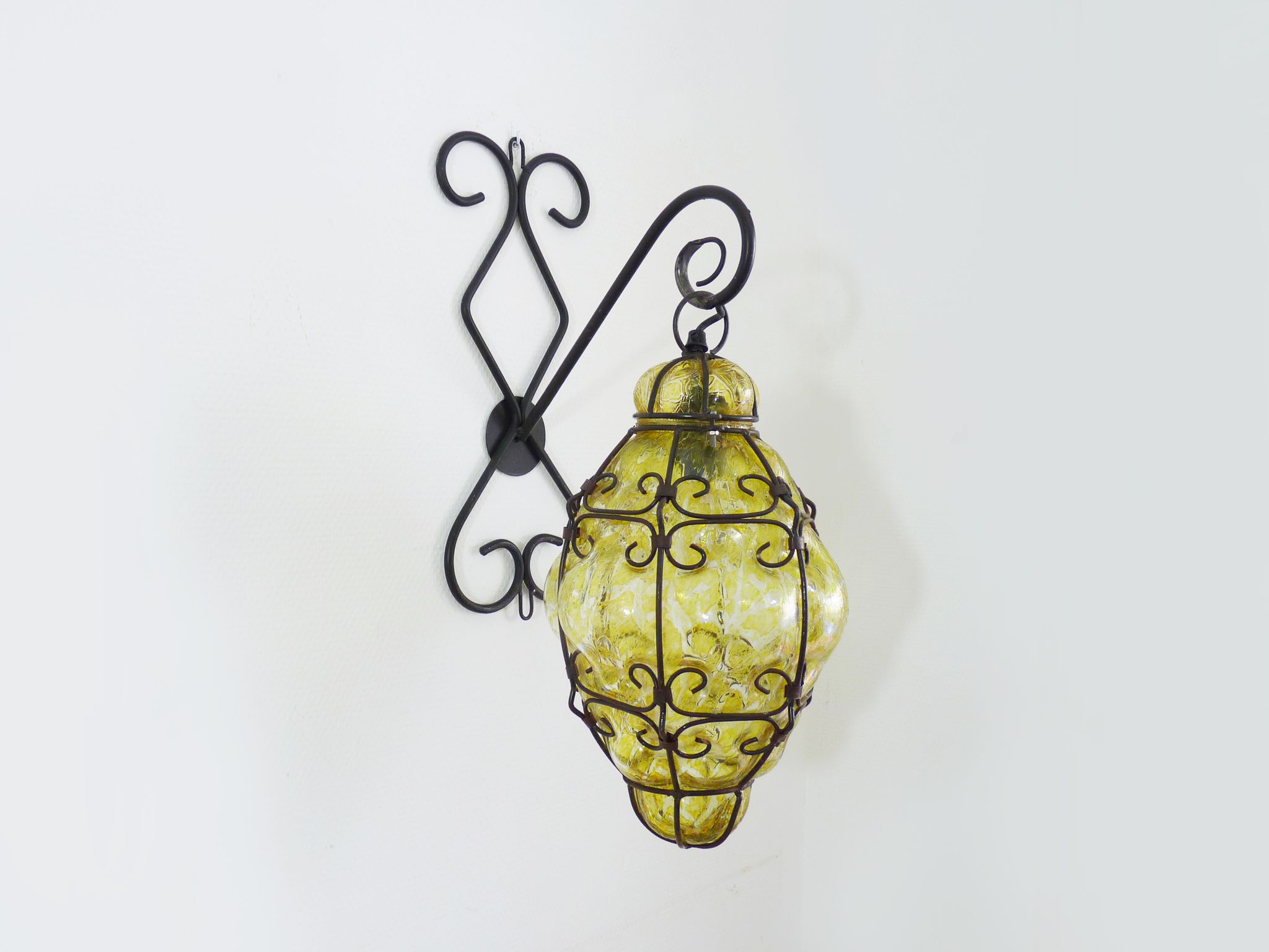 Italian vintage wall lamp in yellow blown glass and wrought iron. Year 70 80
