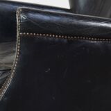 Subtle black armchair with reversible Kelim seat cushion