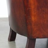 Very luxurious dark brown sheepskin club chair with a more than beautiful patina