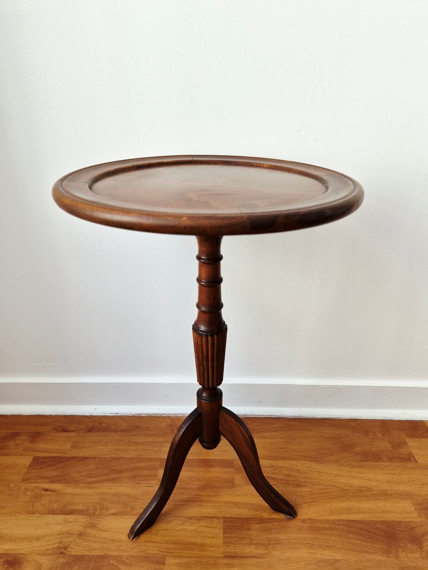 Small tripod wooden table with a vintage round top -