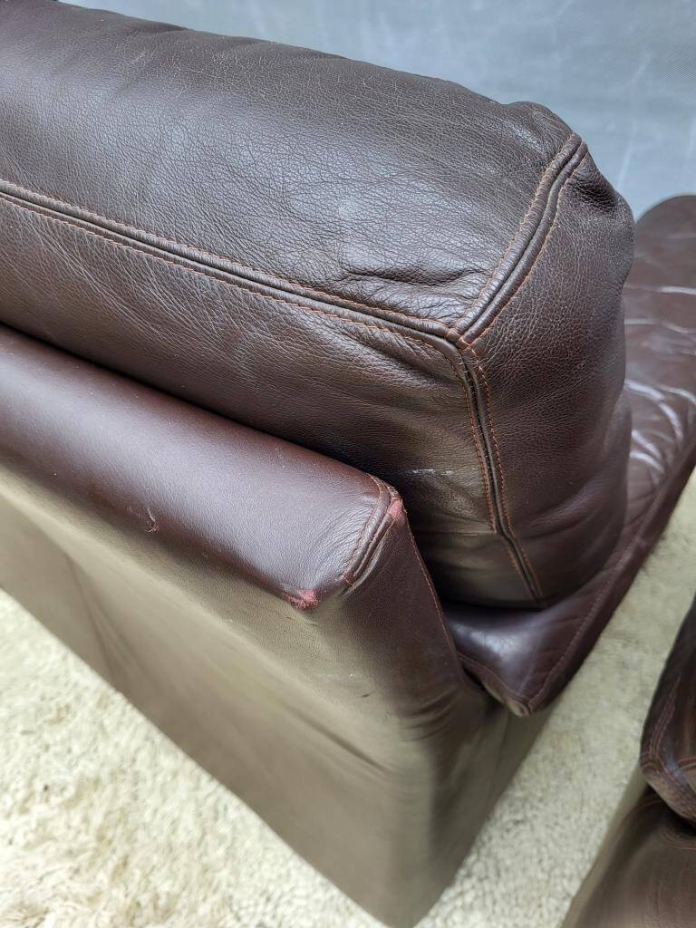 Pair of chocolate leather lounge chairs