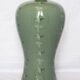 Korean vase in crackled celadon with a pattern of ducks and clouds.