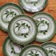 7 earthenware dessert plates with apple decoration and slip-brushed rim, KG Lunéville