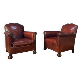 Pair of french leather club chairs, normandy moustache models circa 1910