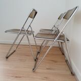 Trio of plexiglass folding chairs