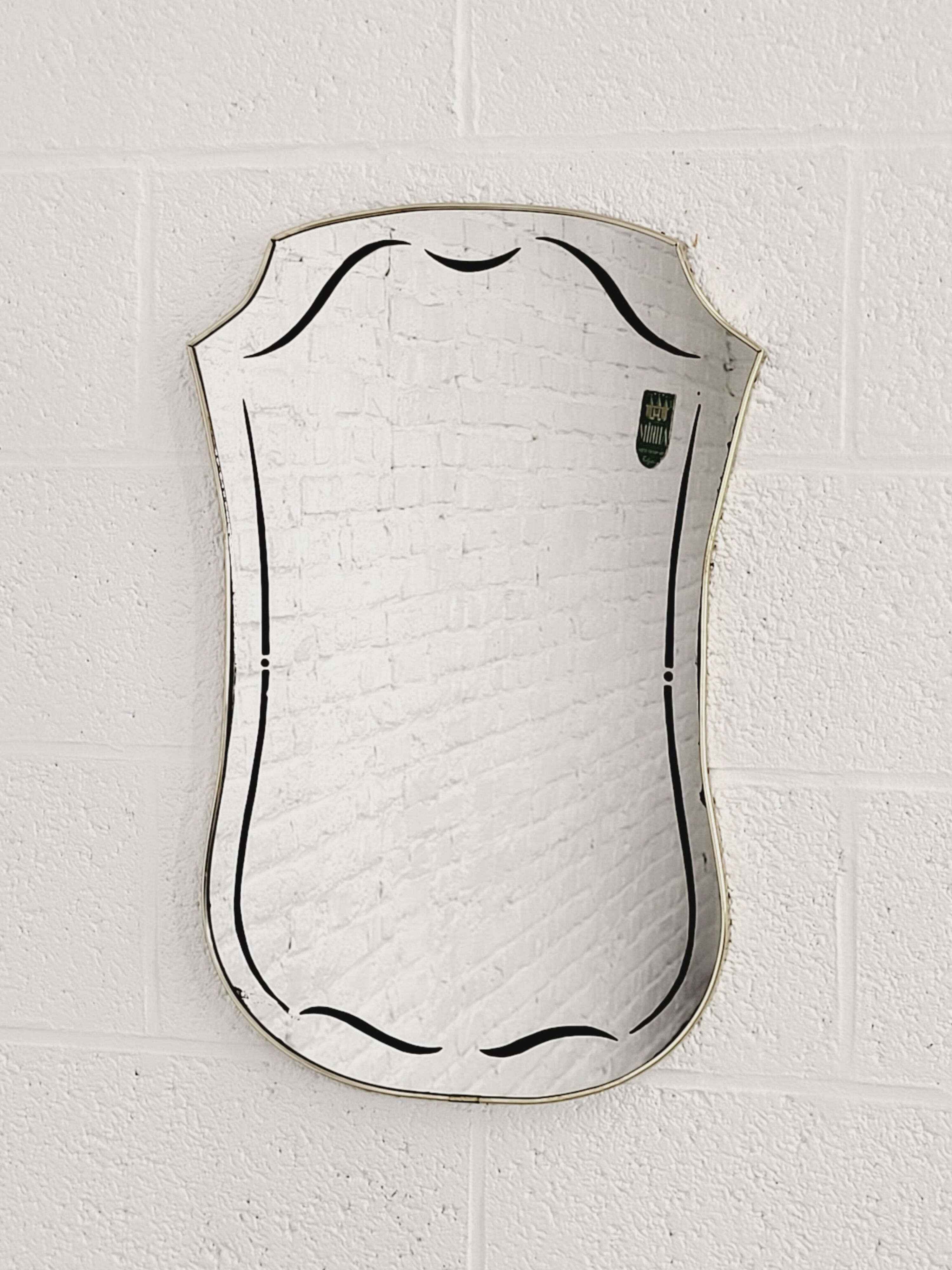 Rearview mirror and screen-printed free-form 60s on gilded frame