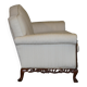 Three-seater canapé carved from solid walnut with claw feet.
