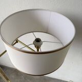 Floor lamp with articulated arm in brass-plated metal