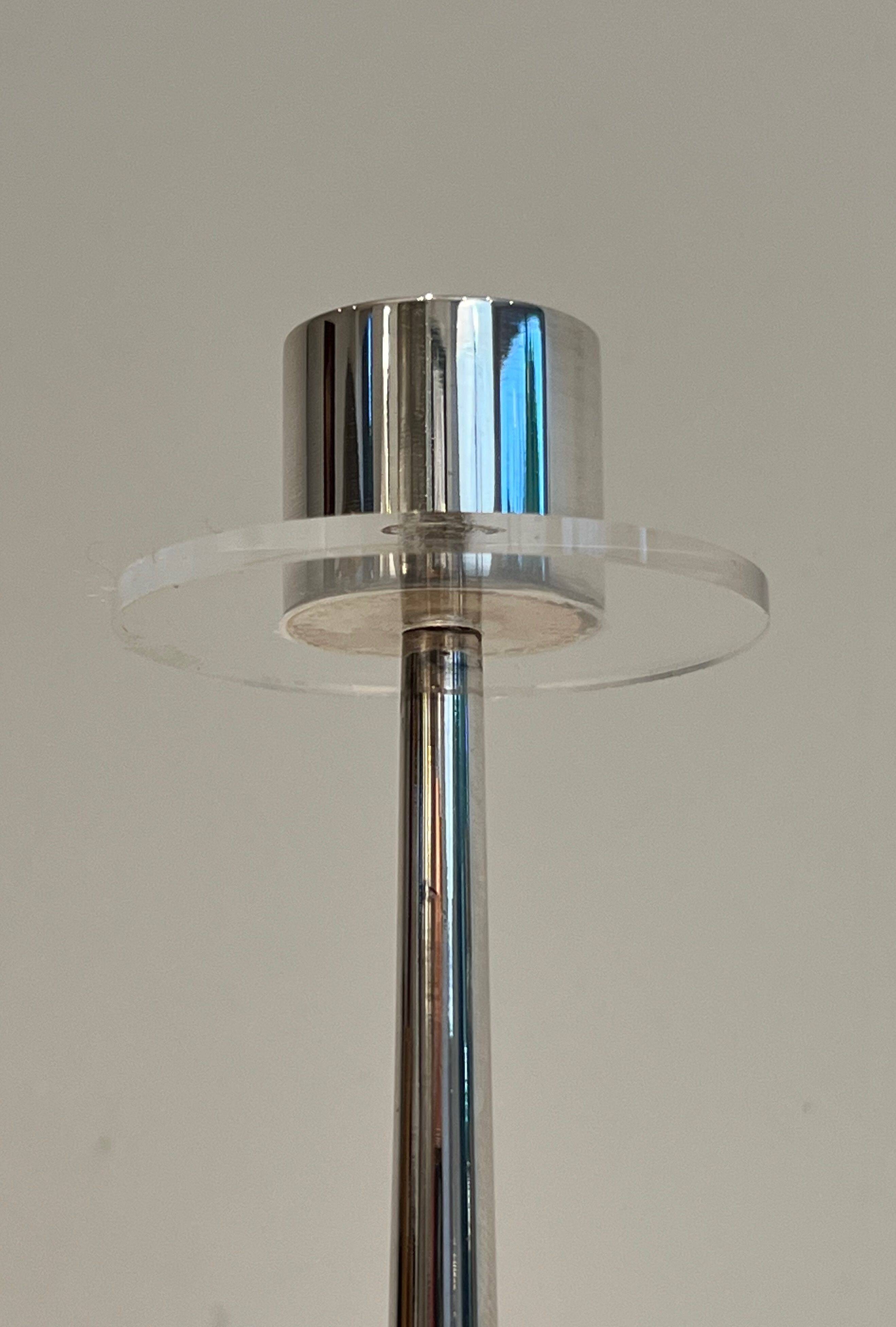 Silver-plated metal and plexiglass design candlestick.