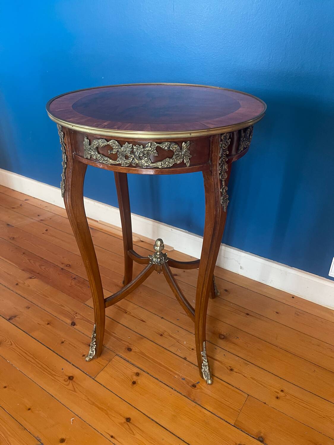 High wooden pedestal table
