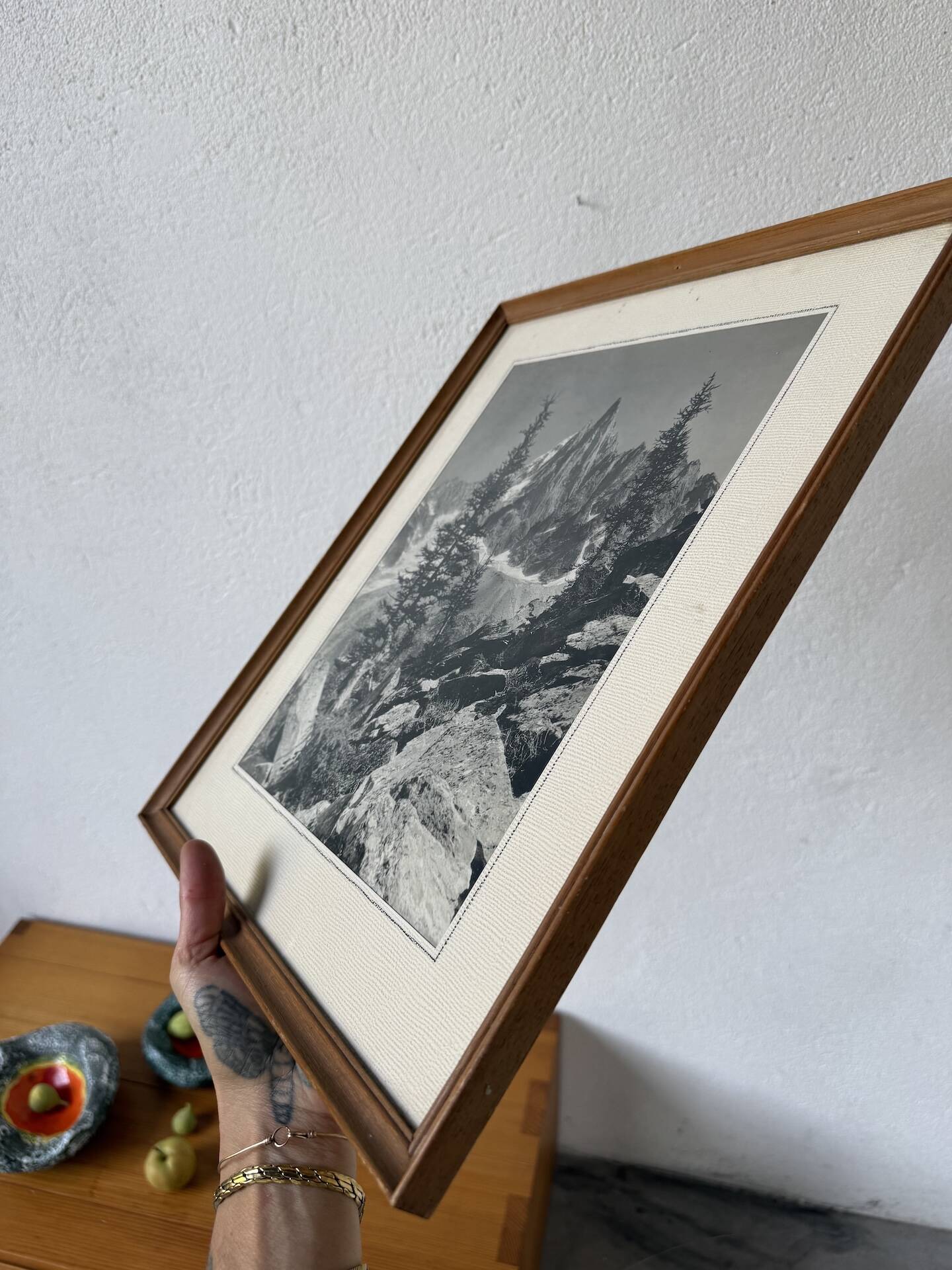 Framed old photo of a mountain landscape.